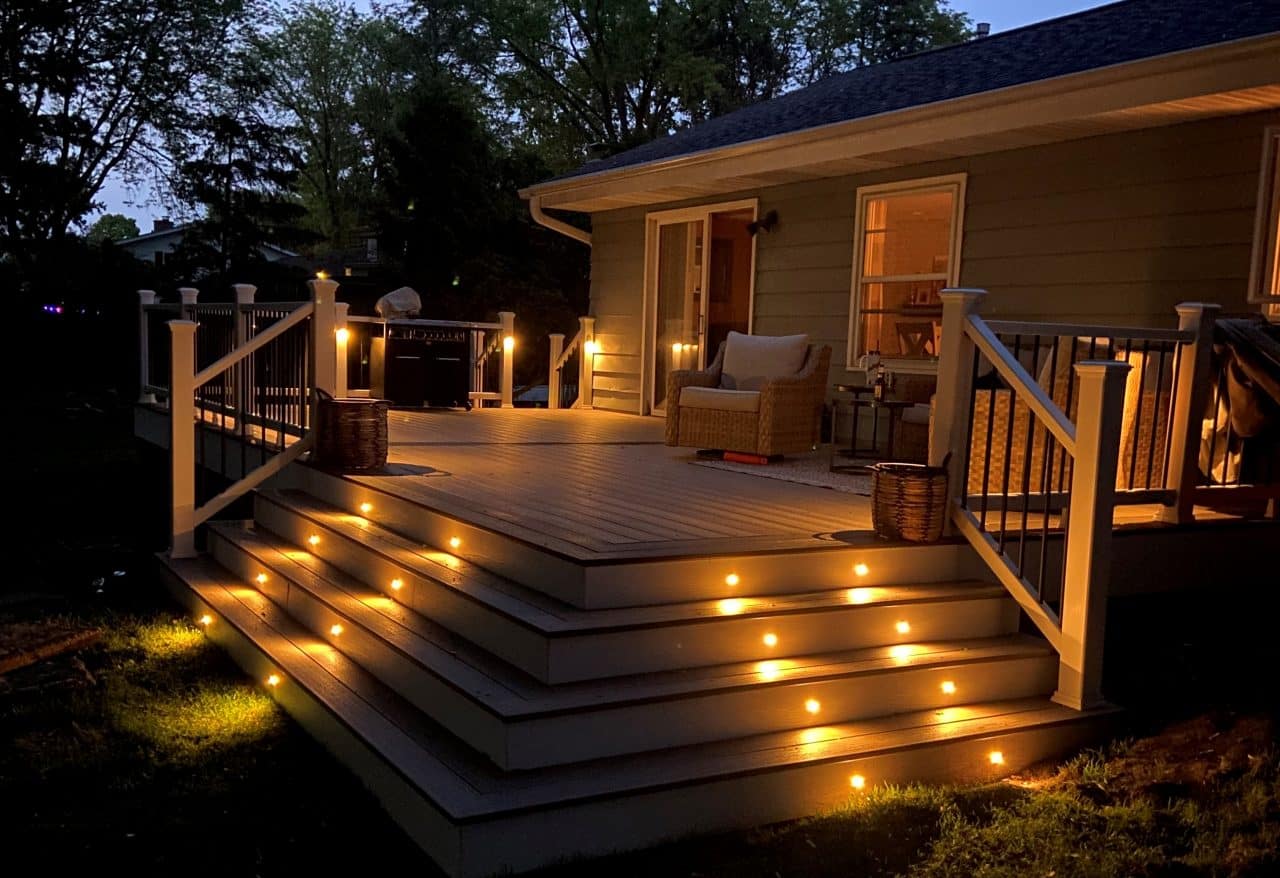 Deck with Trex Outdoor Lighting | Deck with lights leading up stairs at nightime | Backyard Creations | Custom Decks, Porches, and Pergolas