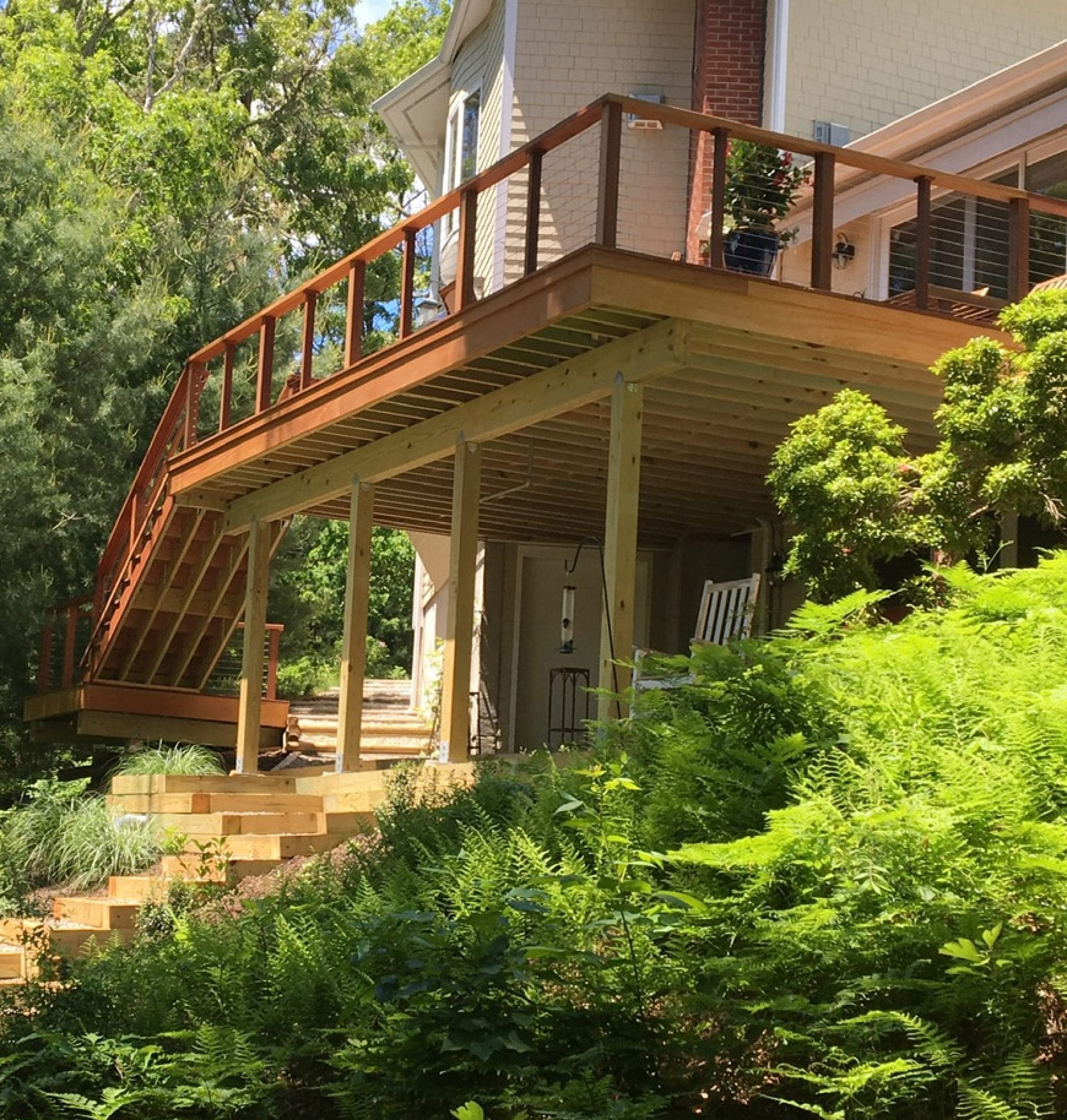 Hardwood Decking | Ipe wood also known as Brazilian Walnut Deck with mahogany stairs leading up to the deck | Backyard Creations | Custom Decks, Porches, and Pergolas